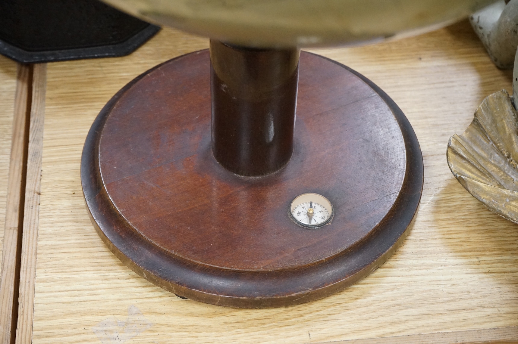 A vintage revolving globe with inset compass to the base, 55cm high